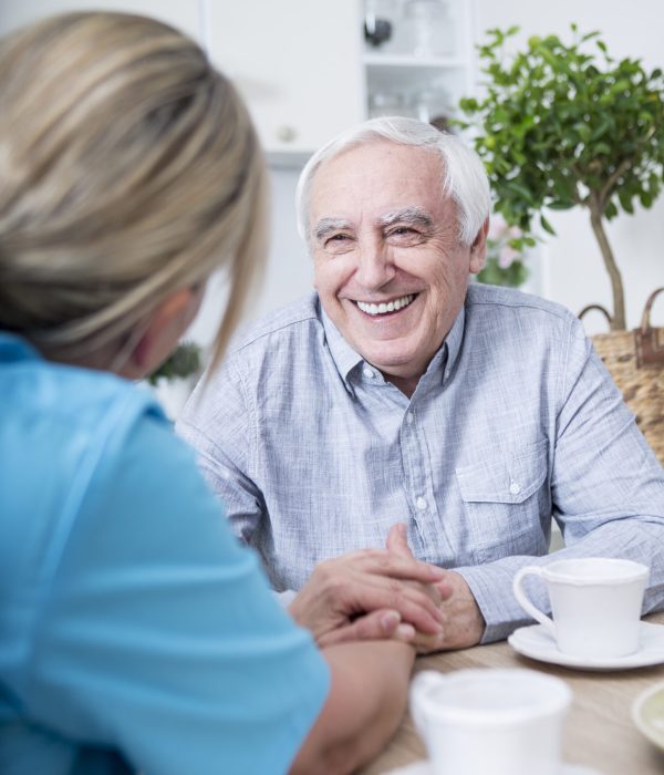 Gereatric nurse listening to elderly patient